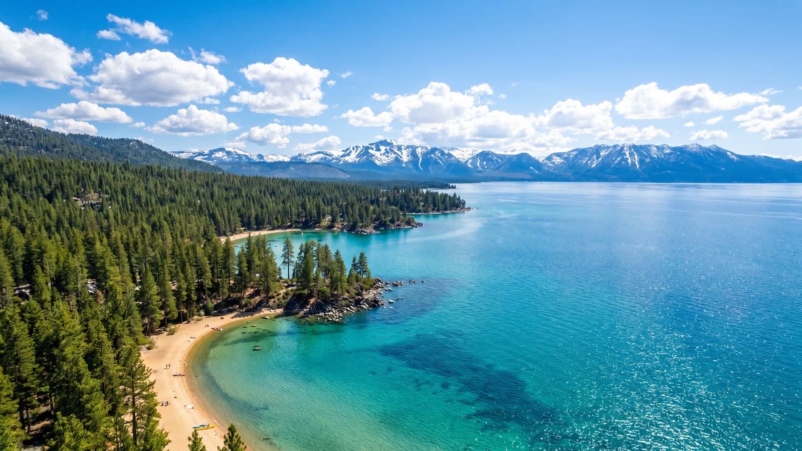 Lake Tahoe Nevada shore — crystal-blue lake and Sierra Nevada mountains from the Nevada side