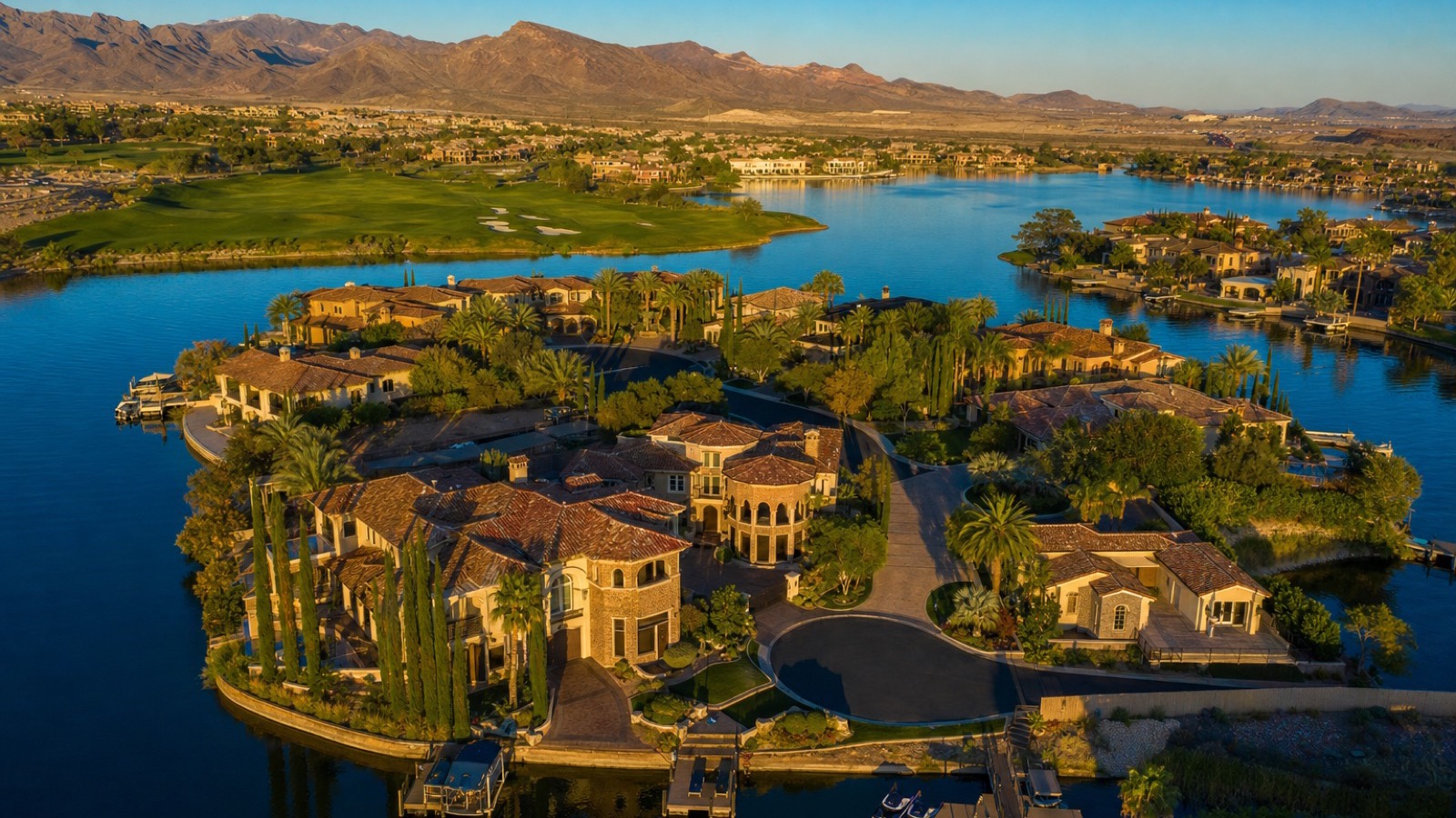 Desert Shores Las Vegas paddleboat dock with waterfront homes and palm trees reflecting in the calm lake water at dusk