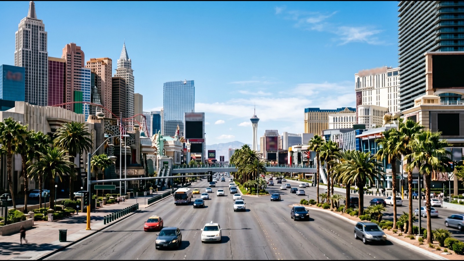 Las Vegas Strip high-rise skyline at twilight with warm lights across the resort corridor and the valley beyond